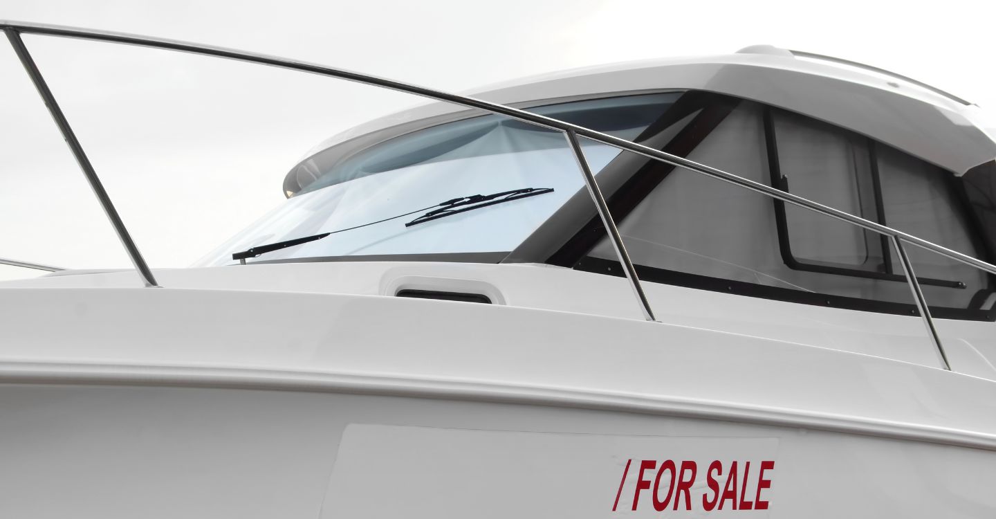 a yacht with a for sale sign on it