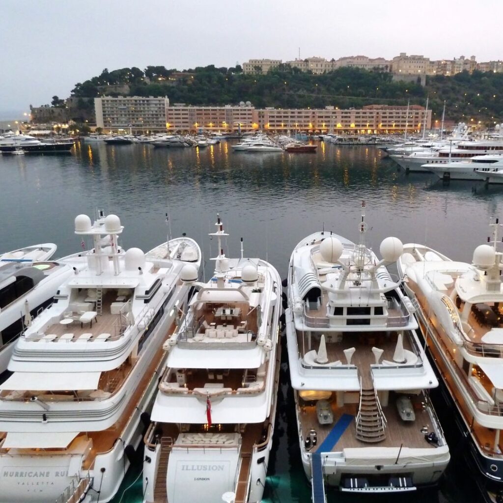 row of yachts at a dock