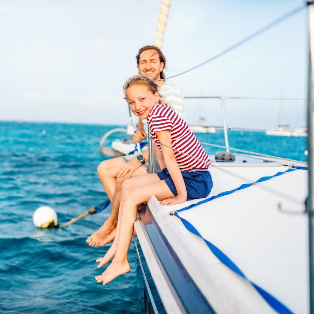 happy father and daughter on a boat