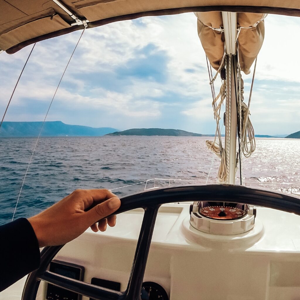 steering a yacht on the water